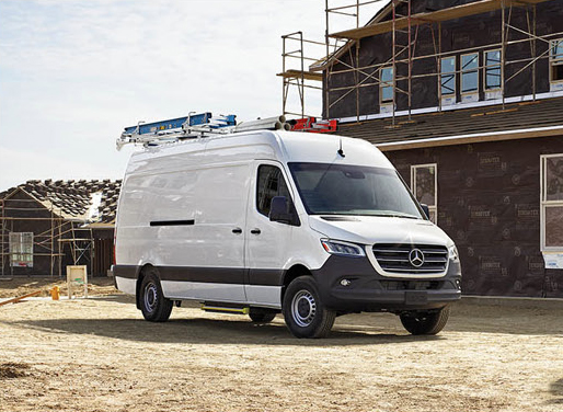 Mercedes-Benz Sprinter Cargo Van parked at a residential construction site.