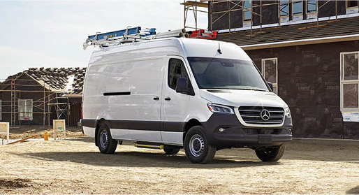 Mercedes-Benz Sprinter Cargo Van equipped with ladder racks at a construction site.