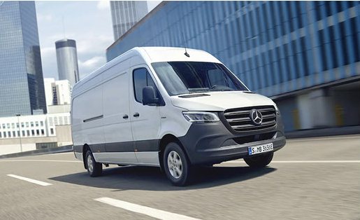 Mercedes-Benz Sprinter Cargo Van driving through an urban city.