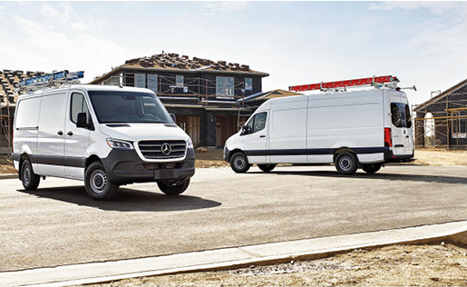 Mercedes-Benz Sprinter Cargo Vans parked at an active construction site.
