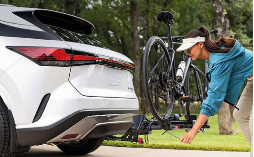 Bicycle mounted on the rear hitch of a Lexus RX SUV.