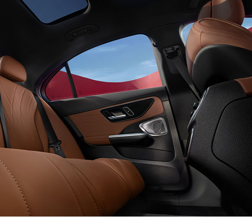 Mercedes-Benz C-Class rear passenger cabin with premium brown leather interior