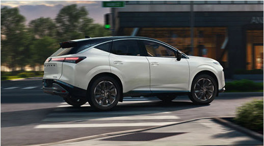 White Nissan Murano SUV driving through the city