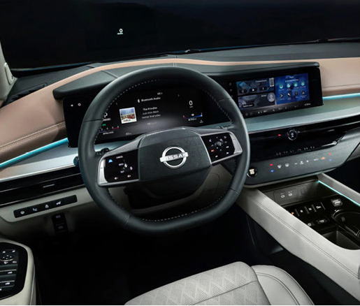 Nissan Murano interior with digital instrument cluster, touchscreen, and ambient lighting