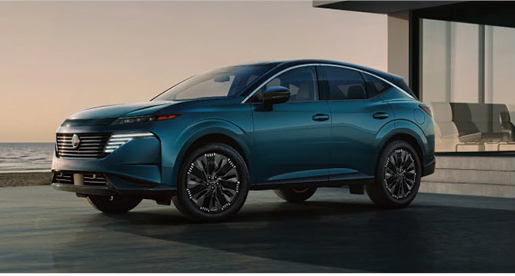 Blue Nissan Murano SUV parked outside a modern waterfront home