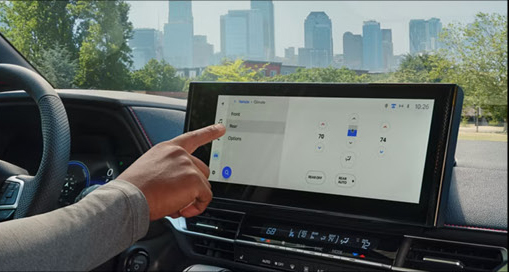 Toyota Sienna infotainment touchscreen displaying climate control and vehicle settings inside the modern cabin.