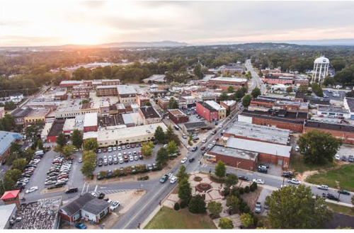 Aerial view of downtown area with water tower at sunset