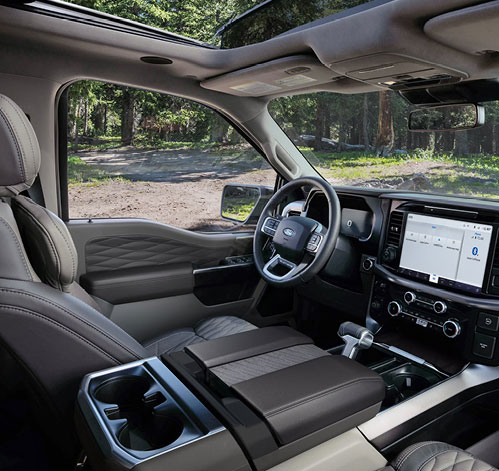 Ford F-150 interior with front seats, panoramic roof, digital display and center touchscreen