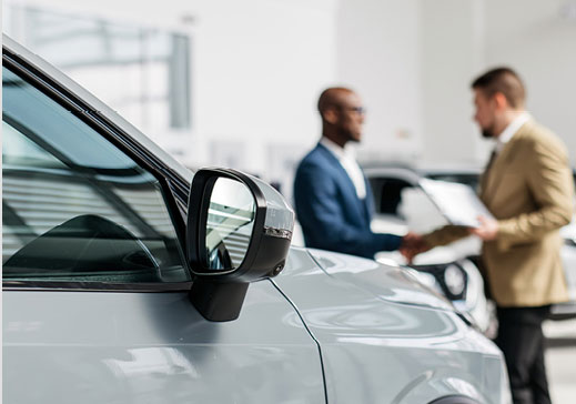 Side mirror of car in showroom