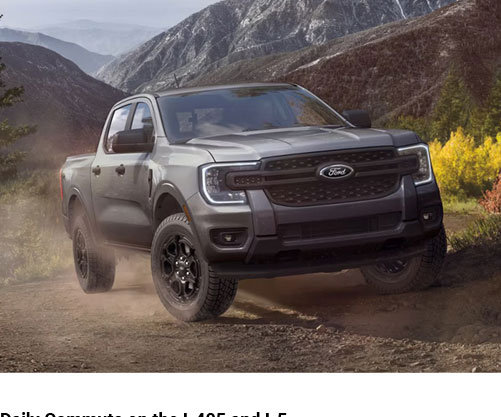 Ford Ranger truck driving off-road on mountain trail