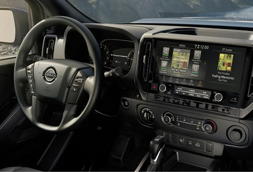 Nissan Frontier interior with steering wheel and touchscreen display