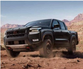 Nissan Frontier truck driving on desert terrain