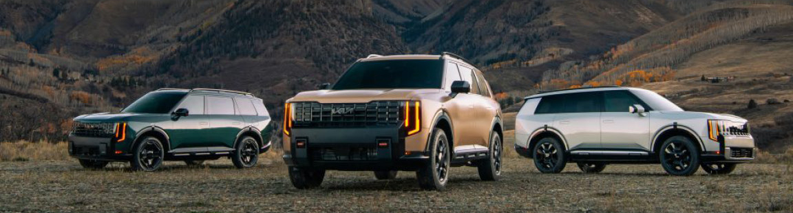 Kia Telluride SUV lineup featuring multiple trim levels displayed in a scenic mountain landscape.