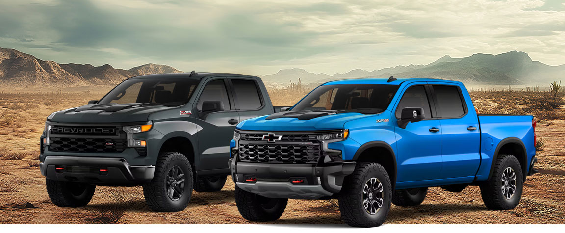 Chevrolet Silverado pickup trucks in an off-road desert setting