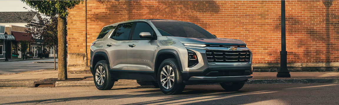 Silver Chevrolet Equinox SUV parked on a city street